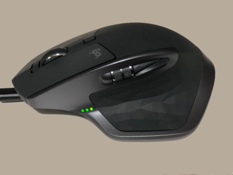 Logitech MX Master 2S wireless mouse with micro USB cable plugged to computer