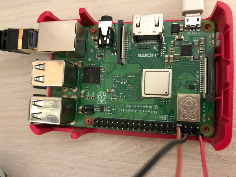 Raspberry Pi 3 Model B+ with three jumper wires connected to GPIO 4, 5v and Ground