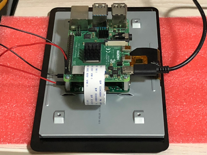 Raspberry Pi 4B connected to 7 inch official touch screen with USB C cable