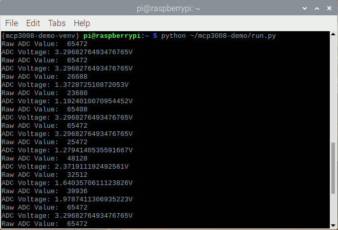 Screenshot of Raspbian terminal after running sample analog input reading script inside mcp3008-demo-venv
