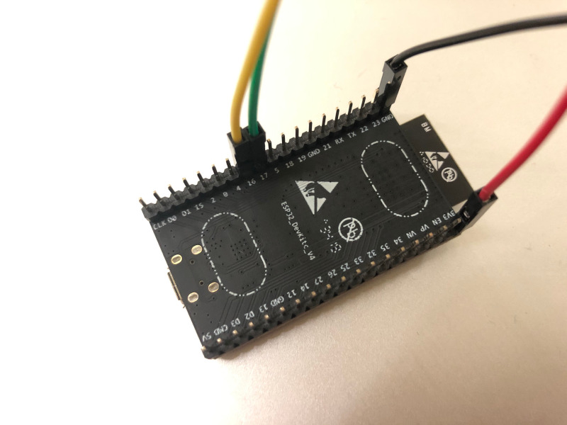 Underside of Espressif ESP32 devkit v4 with GPIO wires connected to GND 3v3 GPIO16 and GPIO17 pins