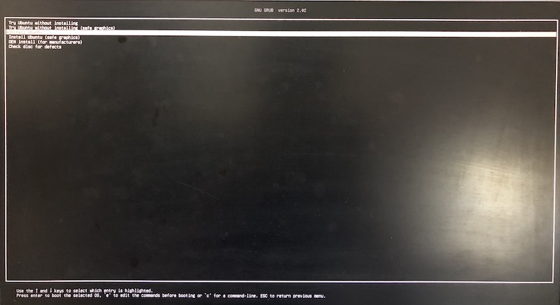 monitor screen showing grub loader of Ubuntu 19.04 with option to install Ubuntu being highlighted