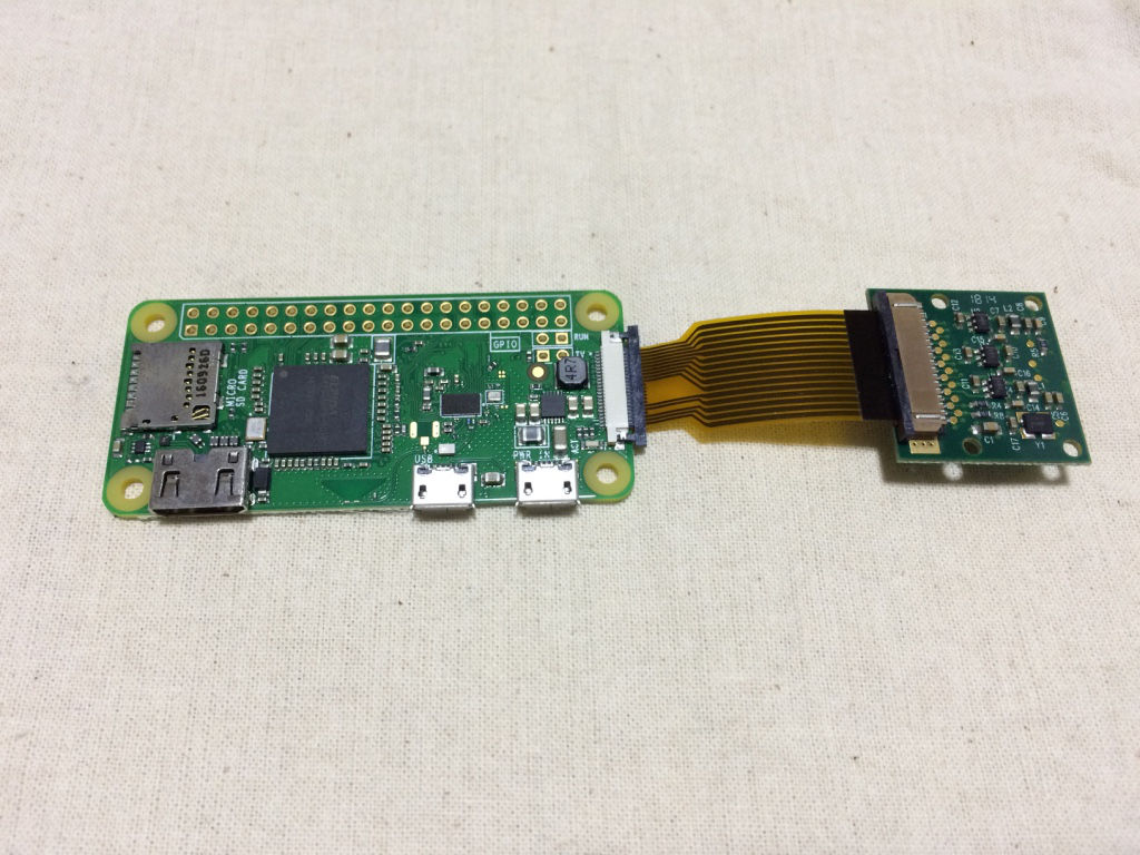 Raspberry Pi Zero W board with camera cable slotted into CSI connector