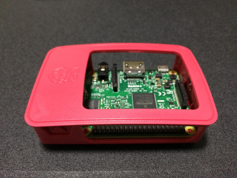 Red parts of Official Case attached with Raspberry Pi 3 board
